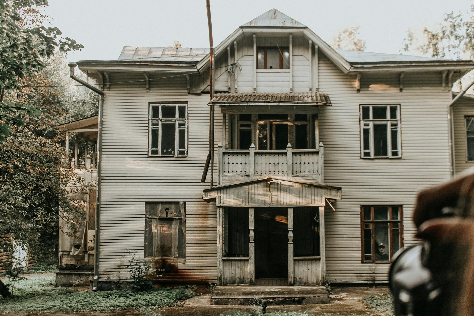 white wooden building with windows